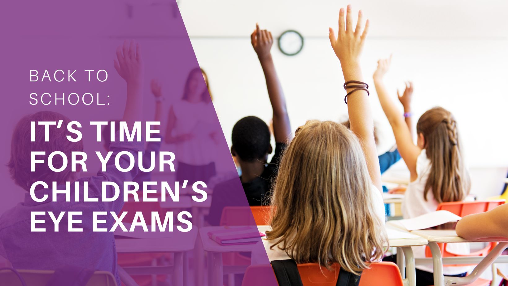 Kids raising their hands in a classroom